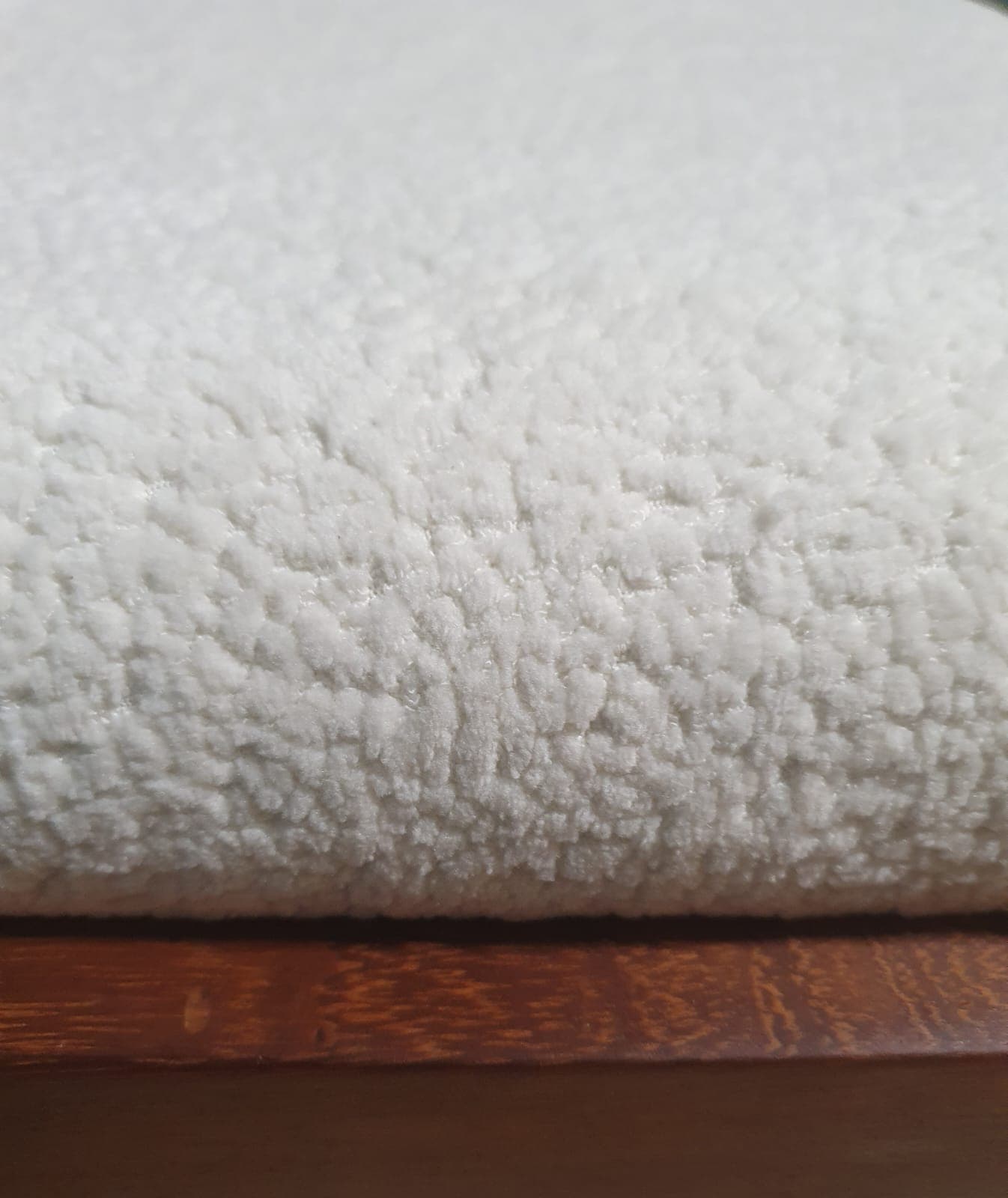 Close-up of off-white bouclé upholstery on restored Duros dining chair